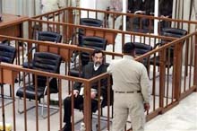 Saddam Walks out Amid Trial Chaos