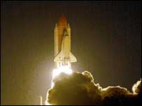 Shuttle lifts off in night launch 