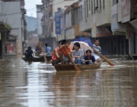 China floods kill 171, more rain expected 