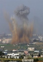 Israel tanks mass near Gaza as jets again pound Gaza