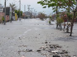 At least 12 killed by floods, waves in Indonesia