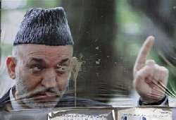 Fraud pushes Karzai to poll runoff 