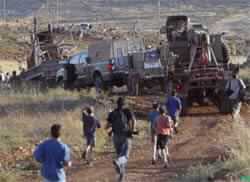 Israel Tears Down Some West Bank Outposts