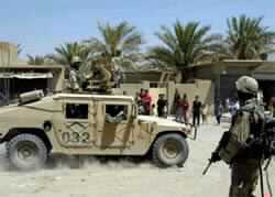 US Troops Detain 180 Iraqis, Arms Depot Blast Kills 30