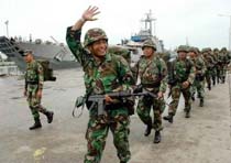 Indonesian Troops Start Aceh Withdrawal 